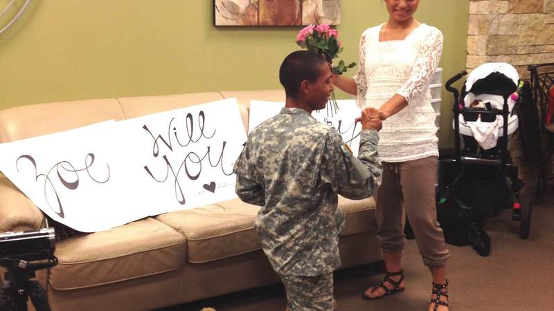 Pvt. Emmanuel Aleman proposes to Pvt. Zoe Tunchez at the USO San Antonio airport center.
