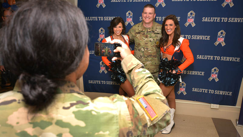 The USO opened its latest Military Entrance Processing Station location on Tuesday in Denver with help from the Super Bowl Champions. The event -- in coordination with the NFL's Salute to Service campaign -- included a meet-and-greet with former Denver Broncos players and Broncos cheerleaders and a tailgate lunch.