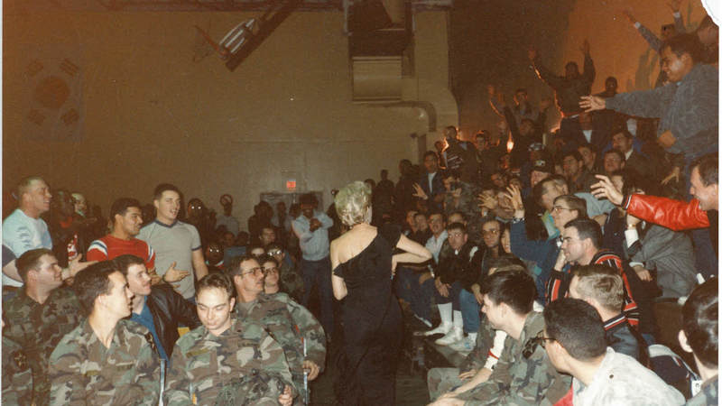 Suzanne Mitchell with service members.