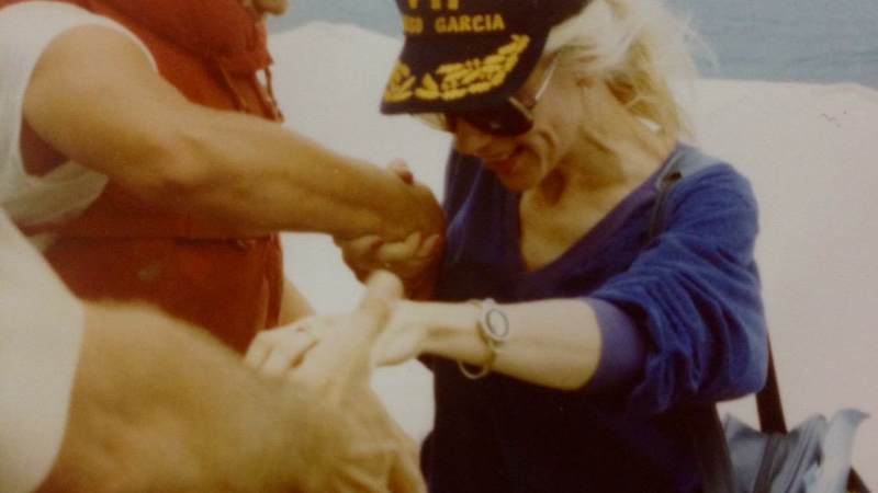 Suzanne Mitchell with service members.
