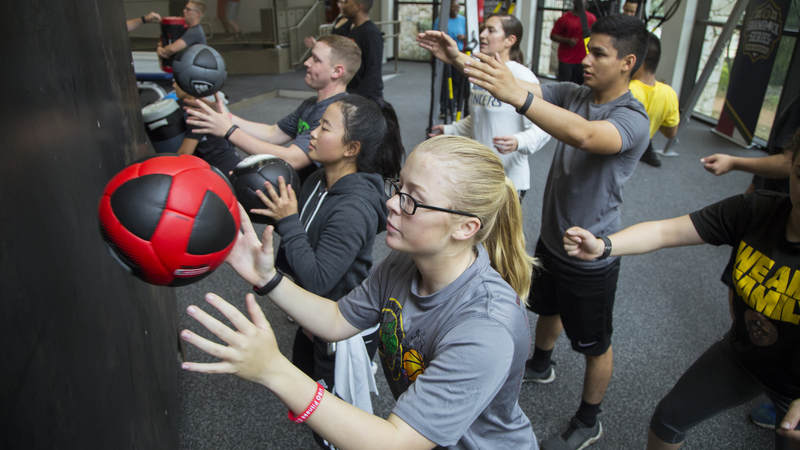 Service members exercise at the new USO wellness center on Joint Base San Antonio.