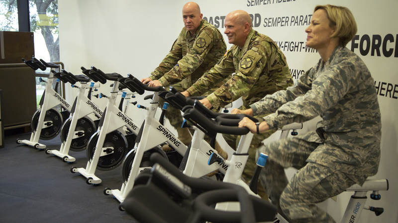 Service members exercise at the new USO wellness center on Joint Base San Antonio.