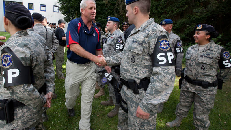 Carolina Panthers head coach John Fox visits with MP's at Kaiserslautern Air Base in Germany during a USO/Armed Forces Entertainment tour stop on June 30, 2010.
