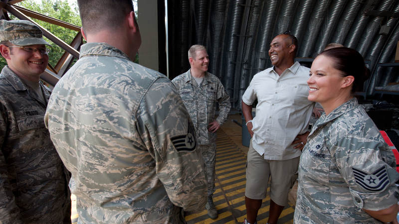 Cincinnati Bengals head coach Marvin Lewis (2nd r) talks with airmen at the 435th Air Mobility Squadron at Ramstein Air Base in Germany on June 30, 2010.