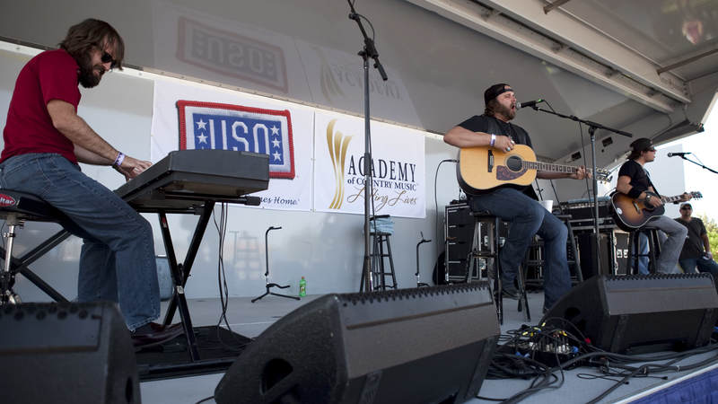 Country music artist Randy Houser performs with his band during the USO/ACM Lifting Lives concert at Nellis Air Force Base in Las Vegas on April 17, 2010.