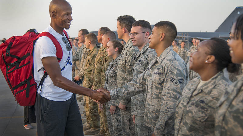 Ten-time NBA All-Star Ray Allen shakes hands with service members stationed in Qatar during the USO Chairman’s Holiday Tour in December.