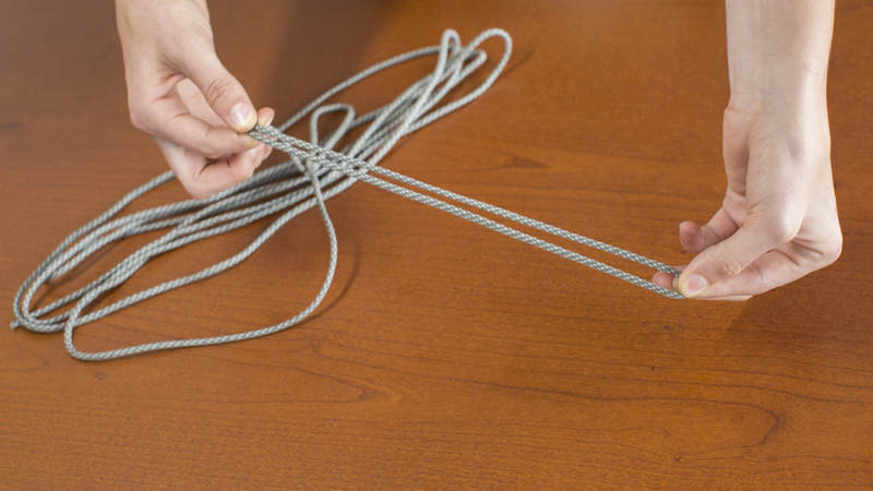 3. Fold the piece of cord in half.