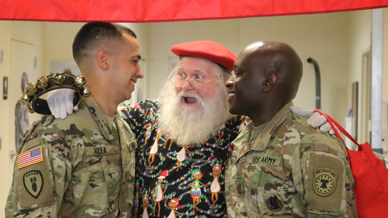 USO volunteers and staff joined Santa on a journey around the Denver area, bringing small gifts and gigantic smiles along with them.