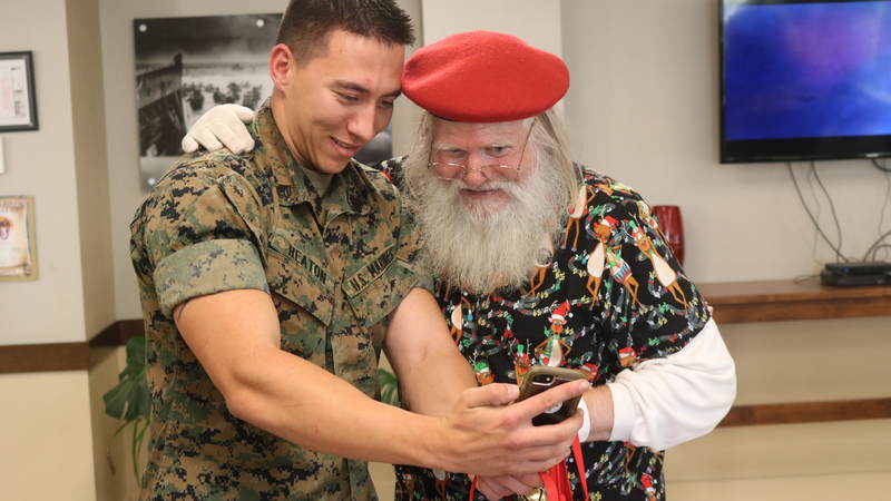 USO volunteers and staff joined Santa on a journey around the Denver area, bringing small gifts and gigantic smiles along with them.