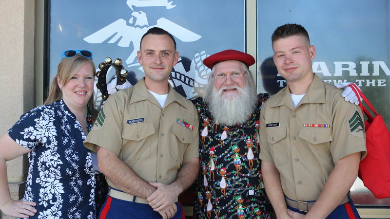 USO volunteers and staff joined Santa on a journey around the Denver area, bringing small gifts and gigantic smiles along with them.
