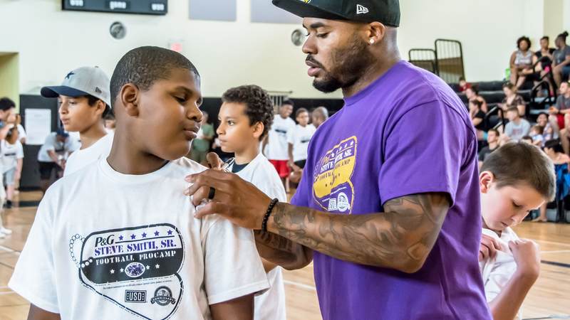Military kids enjoyed Football ProCamp at USO Humphreys with former NFL player Steve Smith Sr.
