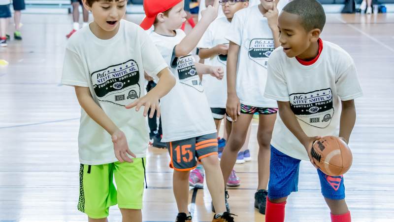 Military kids enjoyed Football ProCamp at USO Humphreys with former NFL player Steve Smith Sr.