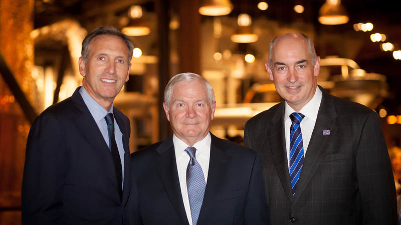 Howard Schultz, Starbucks chairman and CEO, Robert Gates, Former Defense Secretary, and Dr. JD Crouch II, USO president and CEO, come together to discuss bridging the military – civilian drift at the Starbucks hosted Muster.