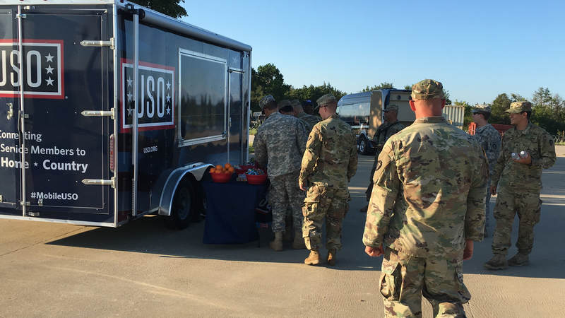 The Mobile USO program team hands out snacks and cold beverages to service members at Fort Swift, the staging location for much of the military's Harvey relief efforts.