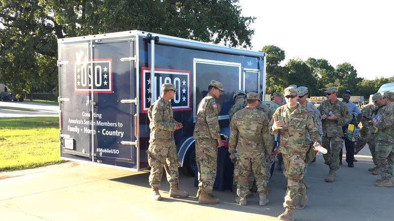 The Mobile USO team hands out snacks and cold beverages to service members at Fort Swift, the staging location for much of the military's Harvey relief efforts.