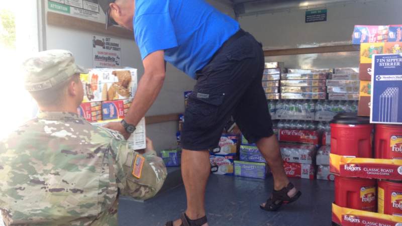 Volunteers stock the USO El Paso Mobile unit, which will head to the Houston area to provide refreshments to service members supporting Harvey relief efforts.
