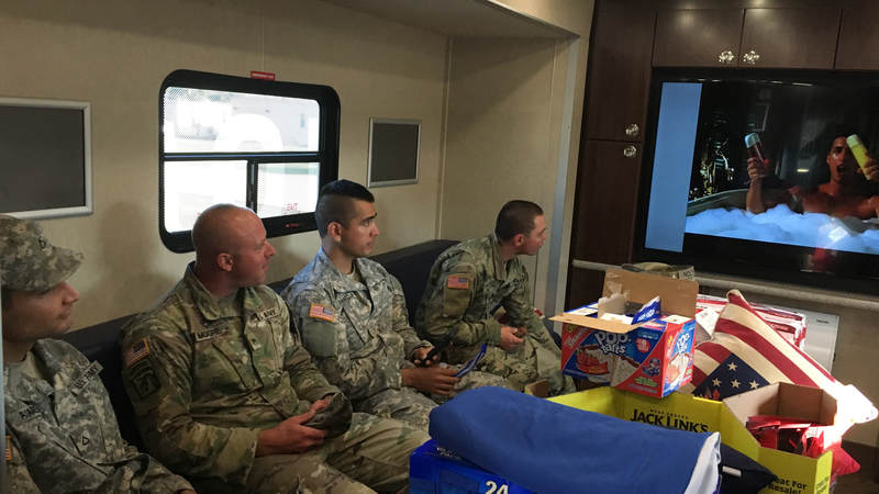 Service members sit inside the USO Mobile unit at Fort Swift, the staging location for much of the military's Harvey relief efforts.