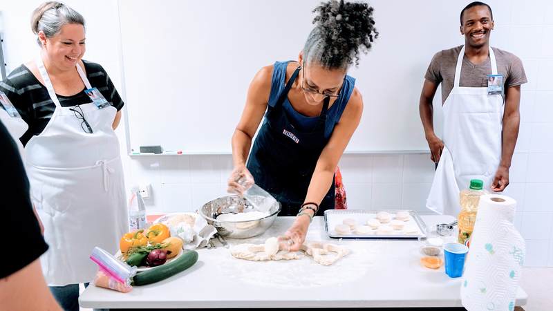 Carla Hall, celebrity chef and co-host of ABC's "The Chew," went on a recent five-day USO tour to Italy and Spain to cook and connect with service members and their families.