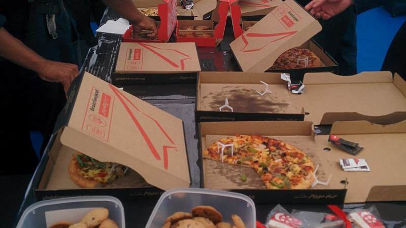 USO Volunteers Darlene & Vincent donated Pizzas, wings and chocolate chip cookies for Sailors from the USS McCain to enjoy after a long day of work.