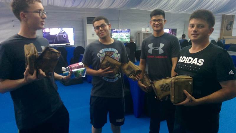 Sailors from the McCain hold USO Care Packages with snacks and much-needed toiletries, sent from headquarters USO in Arlington, Virginia.