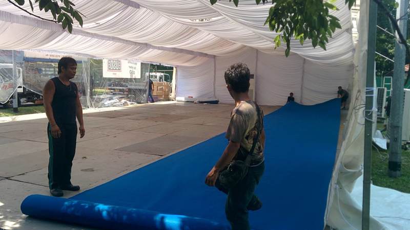 And down goes the flooring! A fully-functional USO Expeditionary Center is constructed in less than a week at the staging location in Singapore where the sailors from the USS McCain are temporarily housed.