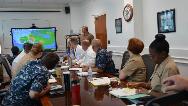 Kevin Robarge, head of operations at U.S. Naval Hospital Guantanamo Bay, provides information to leadership concerning Hurricane Irma.