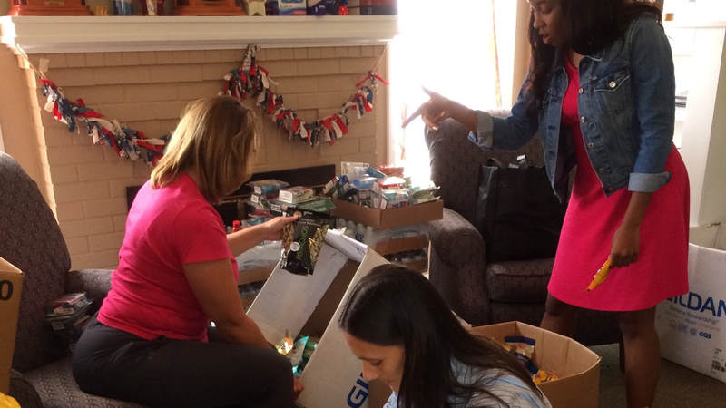 The Greater Jacksonville Florida Area USO team preps care package supplies to hand out to service members supporting Hurricane Irma relief efforts.