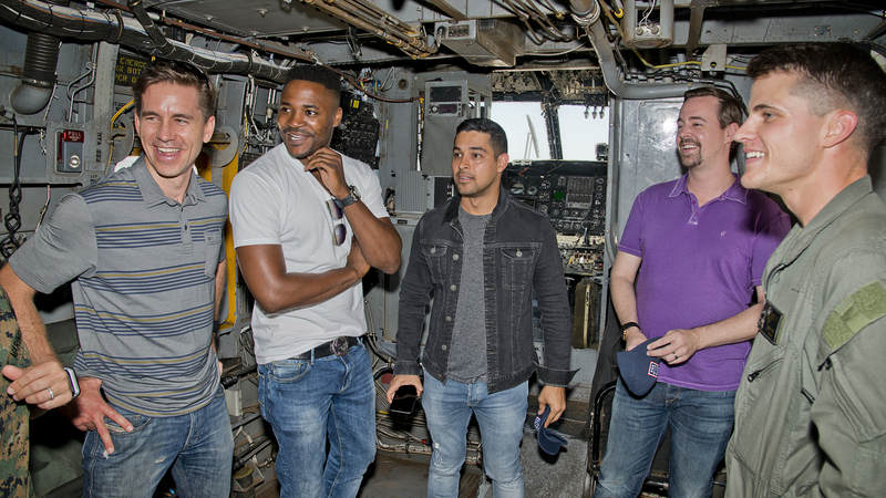 From left to right, Brian Dietzen, Duane Henry, Wilmer Valderrama, and Sean Murray get an up-close look inside a Marine CH-53 Sea Stallion at Marine Corps Air Station Miramar, California.
