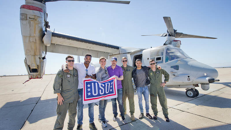 'NCIS' stars pose in front of an MV-22 Osprey helicopter at Marine Corps Air Station Miramar during a USO tour in September.