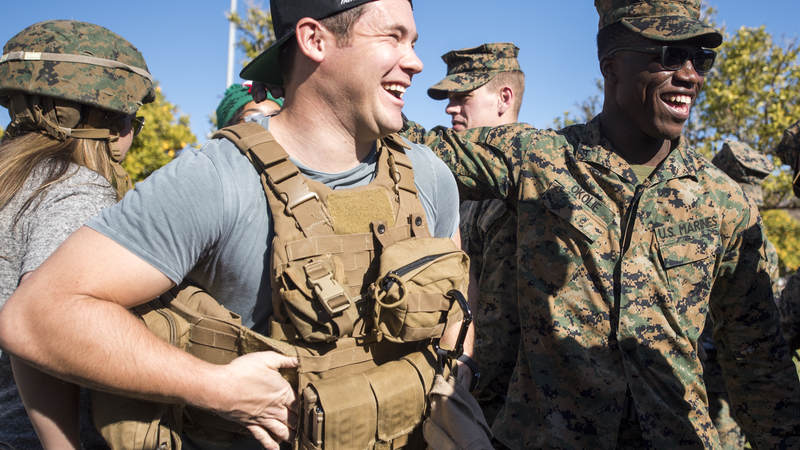Comedian and actor Adam Devine meets with Marines assigned to Special Purpose Marine Air-Ground Task Force – Crisis Response – Africa as part of a troop engagement during the Chairman’s USO Holiday Tour at Morón Air Base Dec. 21.