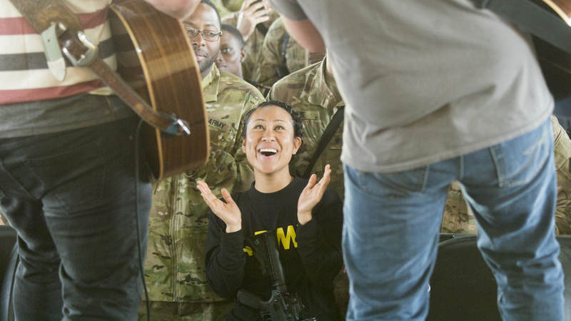 Country music artist Jerrod Niemann performs for service members during the USO Holiday Tour at Taji Military Complex, Iraq, Dec. 25.