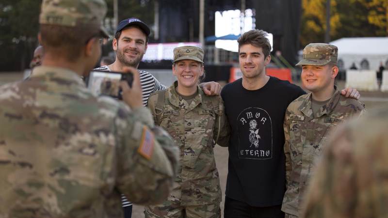The Chainsmokers visited McCrady Training Center in South Carolina on Dec. 19 to get an up close look at military life, tour the USO center on base and perform a surprise concert for hundreds of future soldiers staying at nearby Fort Jackson for the holidays.