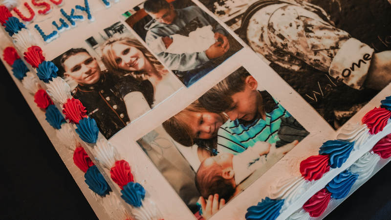 Marine Staff Sgt. Dustin Johnson's birthday cake was one-of-a-kind, thanks to his wife, Melanie, who supplied the photos. USO photo by Amber Craig.