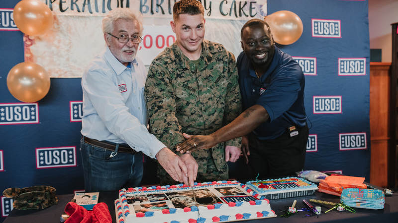 Marine Staff Sgt. Dustin Johnson, who's deployed to Okinawa, Japan, turned 29 earlier this week. He thought he was invited to lunch at USO Camp Hansen and had no idea he was showing up to his own birthday party. USO photo by Amber Craig.