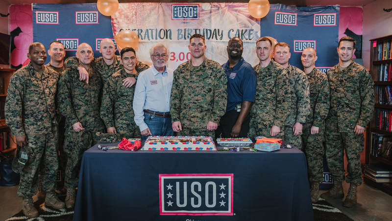 Marine Staff Sgt. Dustin Johnson, center, who's deployed to Okinawa, Japan, turned 29 earlier this week. He thought he was invited to lunch at USO Camp Hansen and had no idea he was showing up to his own birthday party. He celebrated with his fellow Marines and USO staff. USO photo by Amber Craig