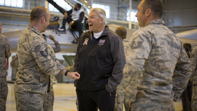 Former NFL head coach Rex Ryan has a laugh during the 2018 USO-NFL tour.