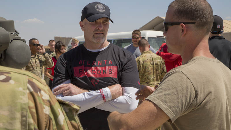 Falcons head coach Dan Quinn talks with troops at Erbil Air Base, Iraq.