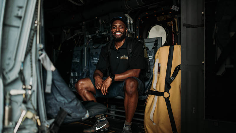 Former New York Giants wide receiver Amani Toomer takes a seat inside a military aircraft during the USO-NFL Legends tour of Okinawa, Japan, on July 25-26. USO photos by Amber Craig
