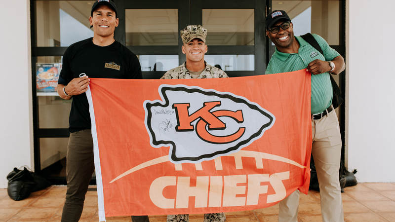 Donnie Edwards, left, and Tony Richardson both played for the Kansas City Chiefs during their NFL careers and they met one of their biggest fans during the USO-NFL Legends tour to Okinawa, Japan, on July 25-26. USO photos by Amber Craig
