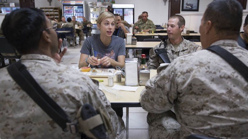 Iliza Schlesinger shares a meal with service members in Afghanistan during the 2014 TODAY USO Comedy Tour.