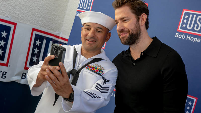 "Jack Ryan" star John Krasinski snaps a photo with a sailor during a USO tour during Los Angeles Fleet Week August 31.