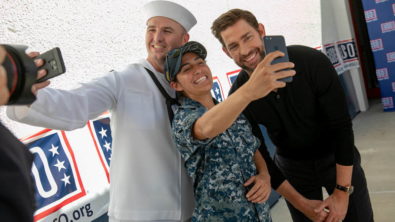 Actor John Krasinski, who stars in the new Amazon Prime series, "Tom Clancy's Jack Ryan," poses with sailors during a USO tour during Los Angeles Fleet Week on August 31.