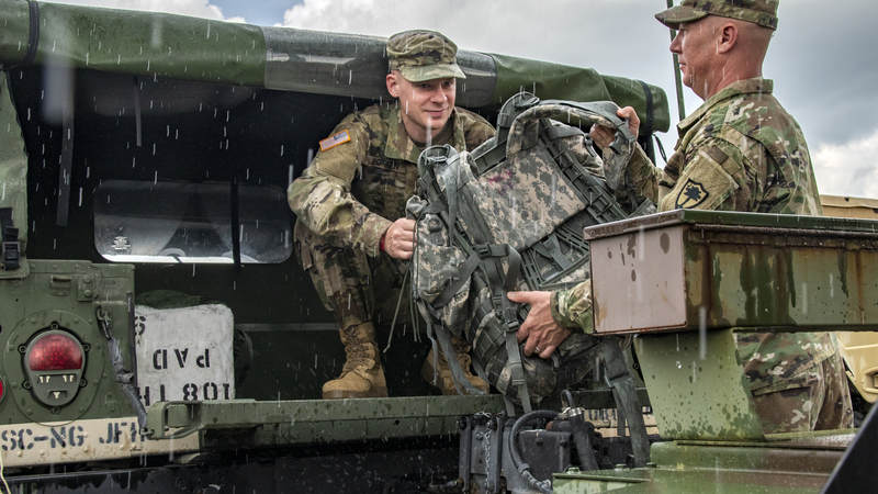 South Carolina National Guard soldiers load gear into a Humvee in preparation of Hurricane Florence.