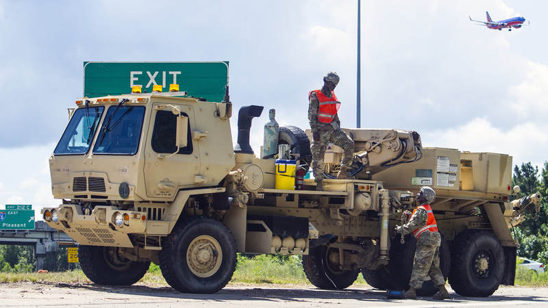 South Carolina Army National Guard soldiers stage recovery equipment to provide support for disabled vehicles during the lane reversal of I-26 in North Charleston, South Carolina during evacuations for Hurricane Florence.