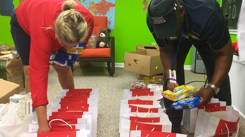 USO South Carolina staff and volunteers package and load care packages for service members providing hurricane relief along the east coast.