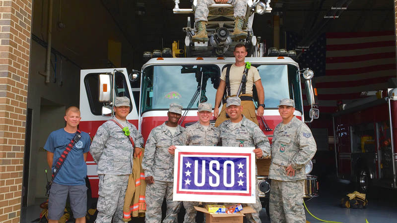Members of the South Carolina National Guard volunteer with the USO to help prepare care packages for service members supporting hurricane relief efforts.