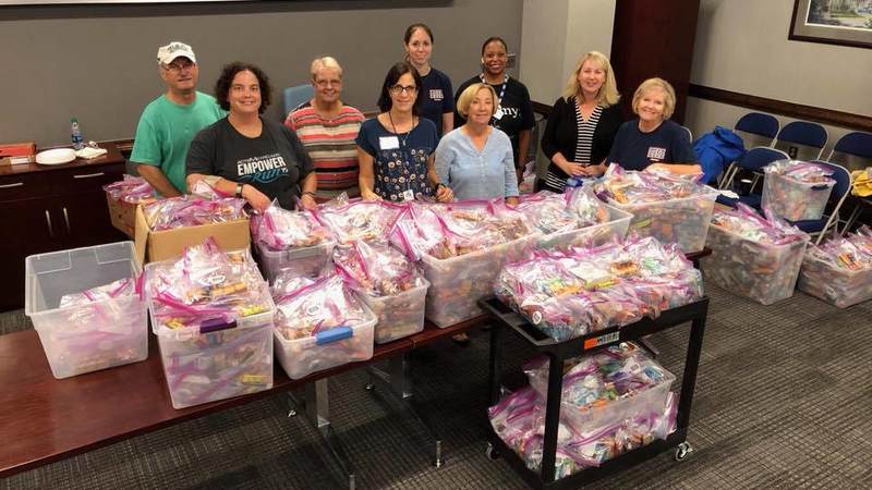 USO South Carolina staff and volunteers package and load care packages for service members providing hurricane relief along the east coast.