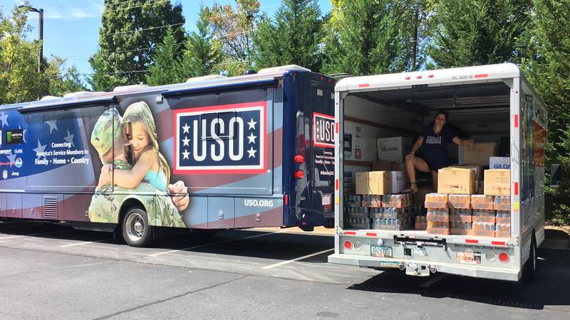 USO South Carolina staff and volunteers load care packages for service members providing hurricane relief along the east coast.