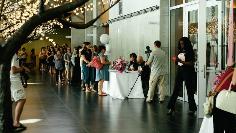 Female military spouses and service members line up outside of USO Okinawa's Sept. 18 Operation That's My Dress event. USO Photo by Ashley Perez.