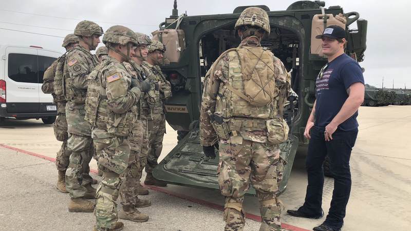 Service members give Jerrod Niemann a tour of the base and explain their duties at Fort Hood.